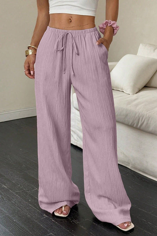 Damen weite Hose mit Struktur und Knotendetail in Vorderansicht