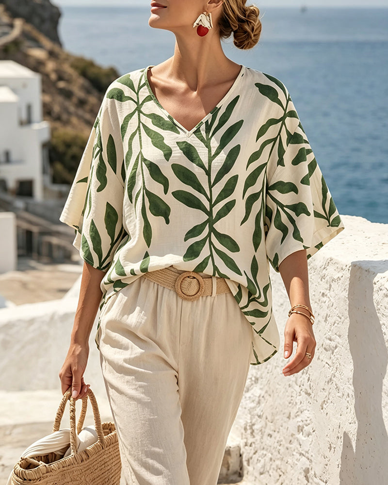 Damenbluse mit Blattprint und V-Ausschnitt in Rückansicht