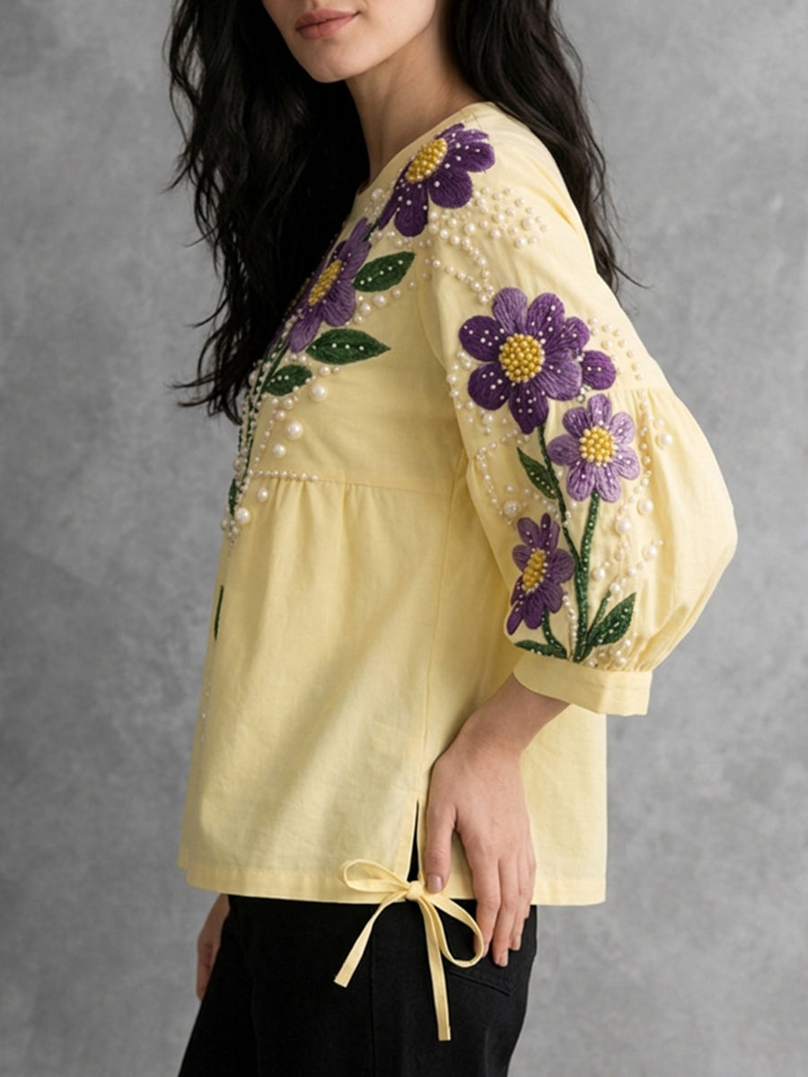Damenbluse in Gelb mit Rundhalsausschnitt, Bindedetail und bestickten Details