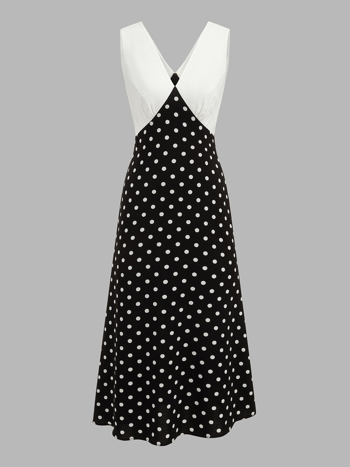 Langes Damenkleid mit Tupfenmuster und fließender Silhouette