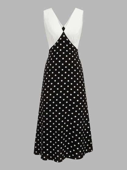 Langes Damenkleid mit Tupfenmuster und fließender Silhouette