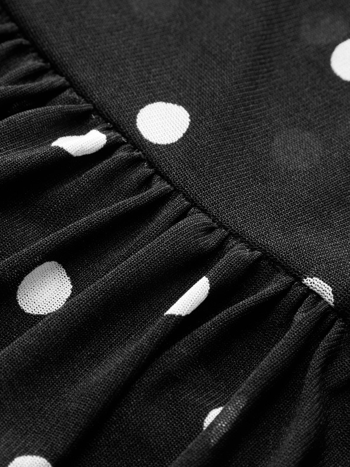 Rückenansicht des Damen Mesh Tops mit Polka Dots