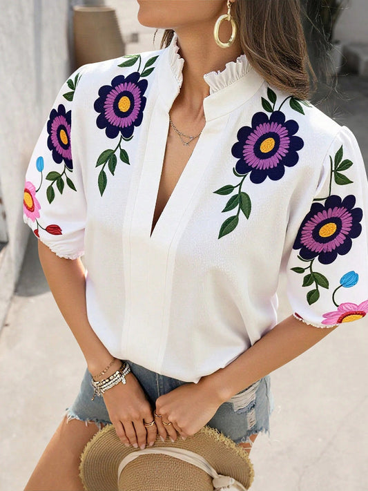 Damenbluse mit Blumenprint und Puffärmeln in Vorderansicht