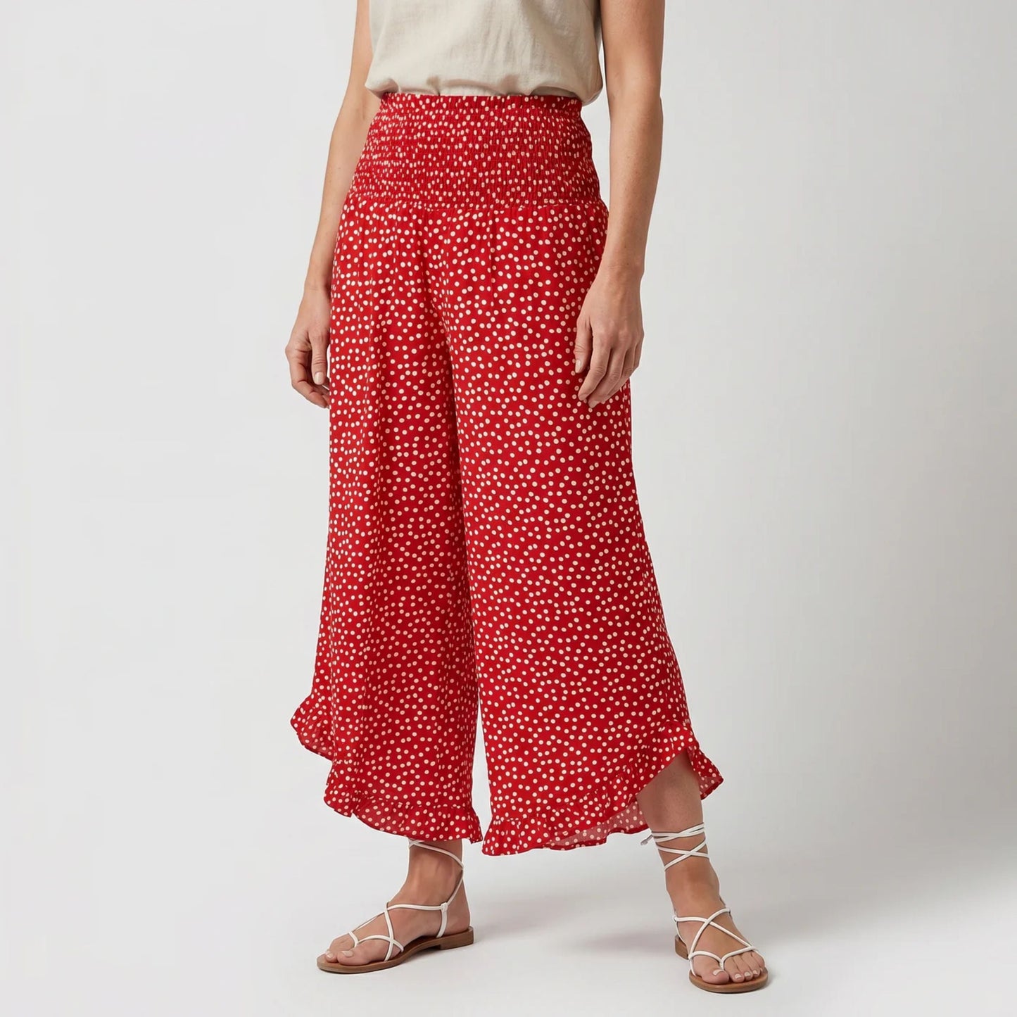Damenweite Hosen mit locker fallendem Schnitt und gepunktetem Muster