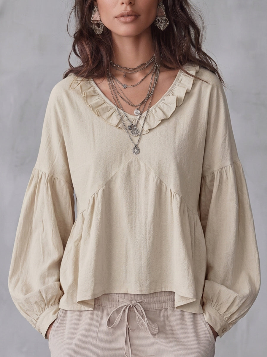 Damenbluse in Uni-Farbe mit Volantbesatz und plissierten Details