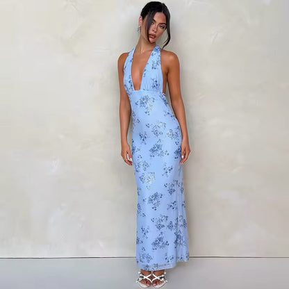 Elegantes blaues Damenkleid mit floralem Muster und offenem Rücken