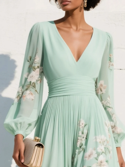 Grünes florales Midikleid für Damen in Rückansicht mit fließender Silhouette