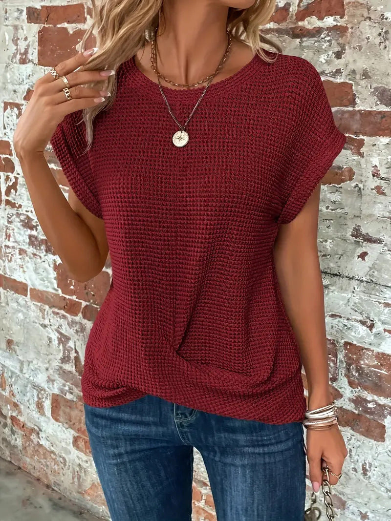 Damen Stricktop mit Struktur und Kurzarm in Seitenansicht